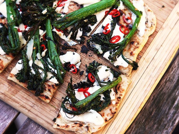 Grilled pizza with grilled broccolini, chilies, and garlic
