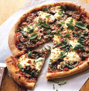 Grilled pizza with harissa and herb salad