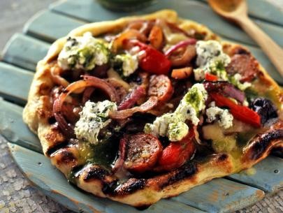Grilled pizza with hot sausage, grilled peppers and onions and oregano ricotta