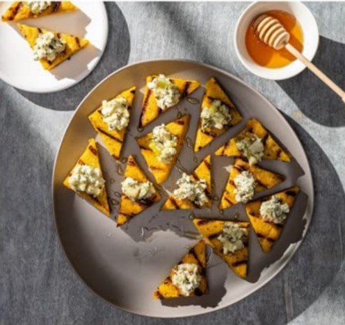 Grilled polenta with charred scallion and Gorgonzola topping