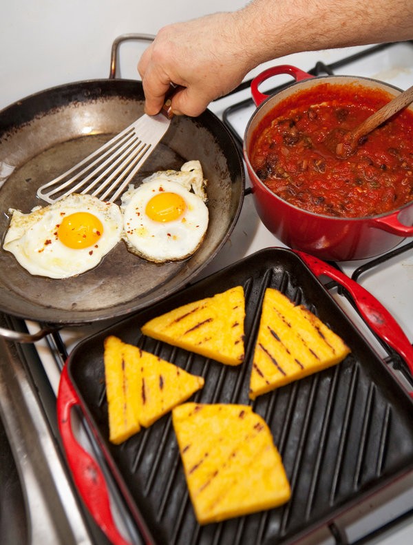 Grilled polenta with spicy tomato sauce and fried eggs