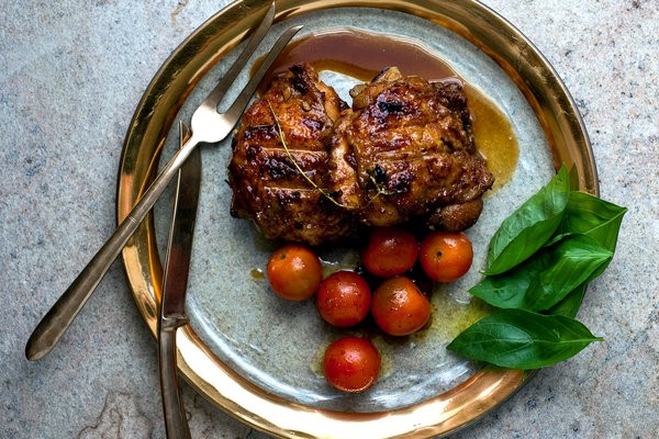 Grilled pomegranate-glazed chicken with tomato salad