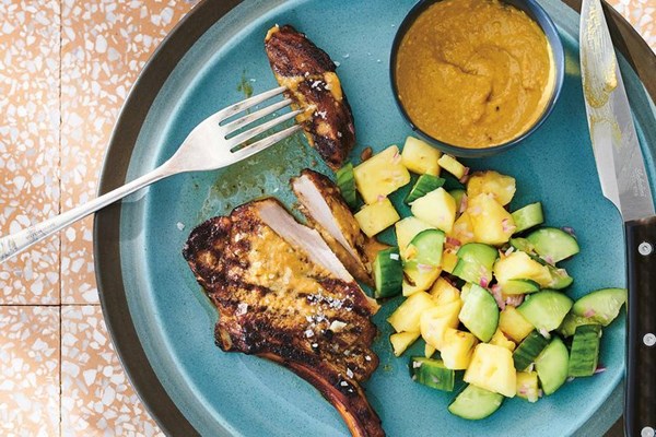 Grilled pork chops and cashew satay with pineapple and cucumber relish