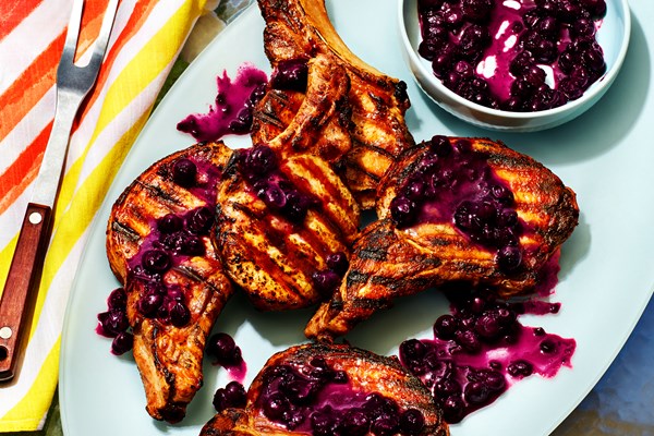 Grilled pork chops with burst blueberry sauce