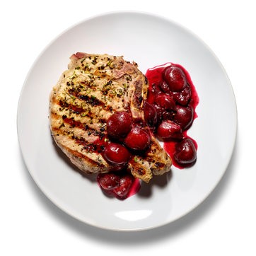 Grilled pork chops with cherry sauce