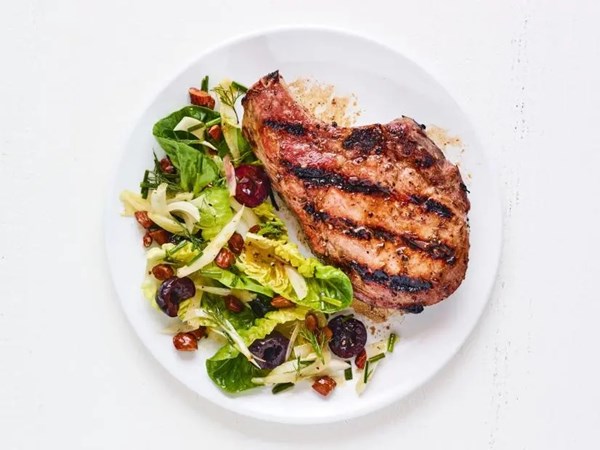 Grilled pork chops with cherry-fennel salad