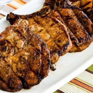 Grilled pork chops with soy sauce, cumin, lime, and oregano