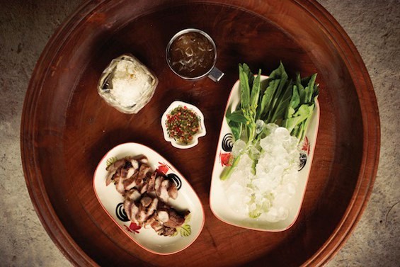 Grilled pork neck with spicy dipping sauce and iced greens (Muu kham waan)