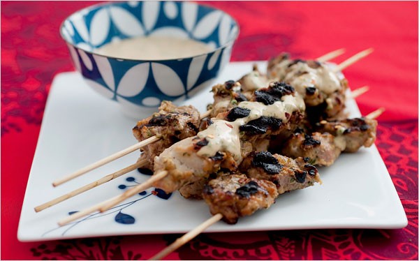 Grilled pork skewers with peanut-basil sauce