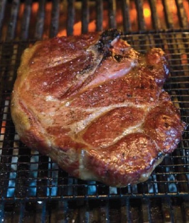 Grilled pork steak with KC-style barbecue sauce