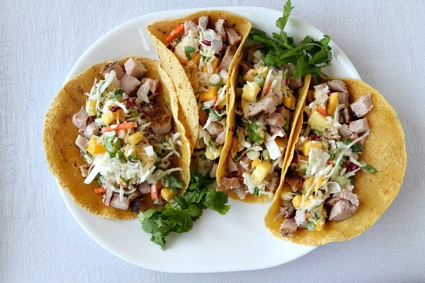 Grilled pork tacos with tropical slaw