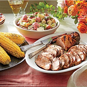 Grilled pork tenderloins with corn on the cob