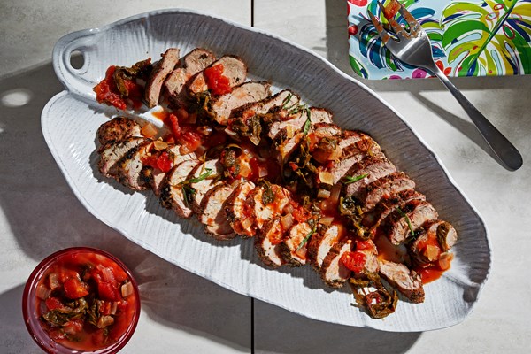 Grilled pork tenderloins with tomato and greens ragu