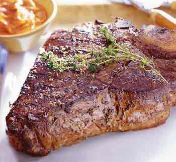 Grilled porterhouse steak with paprika-Parmesan butter