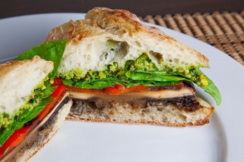 Grilled portobello and roasted red pepper sandwich with pistachio pesto
