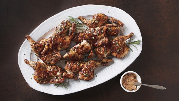 Grilled poussin with shallot balsamic butter