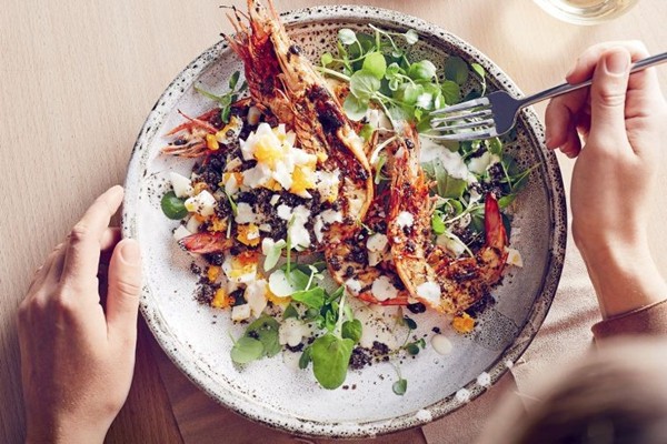 Grilled prawn Caesar salad with rye crumbs and yoghurt dressing