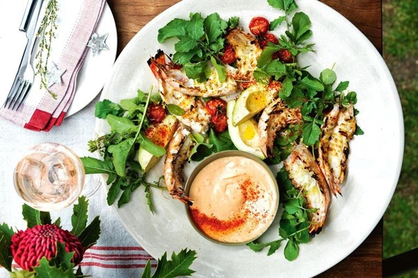 Grilled prawns with cocktail sauce and tomatoes