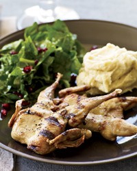 Grilled quail with spinach-pomegranate salad