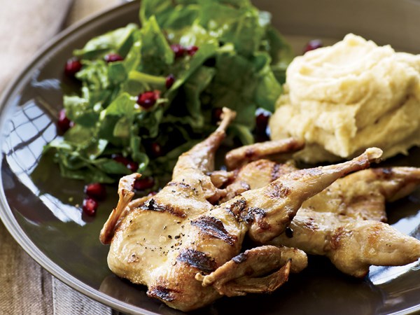 Grilled quail with spinach-pomegranate salad