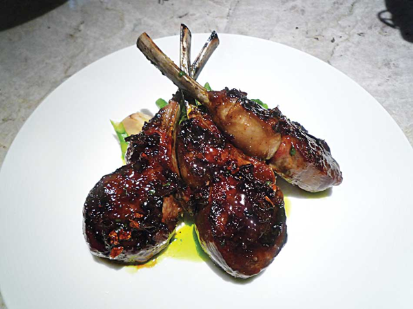 Grilled rack of lamb with smoked chile glaze, king oyster mushrooms & broccolini
