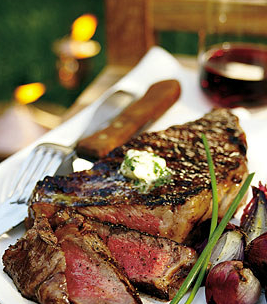 Grilled rib-eye steaks with parsley-garlic butter