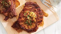 Grilled rib-eye steaks with shallot-jalapeño-tomato butter