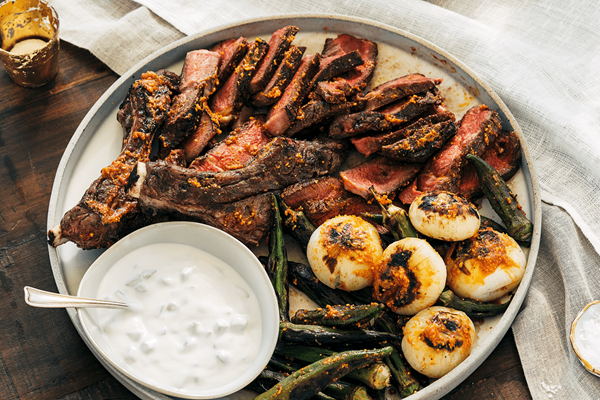Grilled rib eye steaks with okra suya and cucumber-yogurt sauce