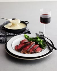 Grilled rib steak with brandy-peppercorn sauce