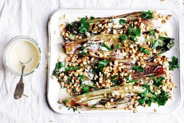 Grilled romaine salad with corn and creamy anchovy garlic vinaigrette 