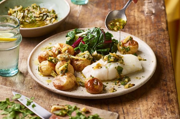Grilled salad onion gremolata with baked cod & new potatoes