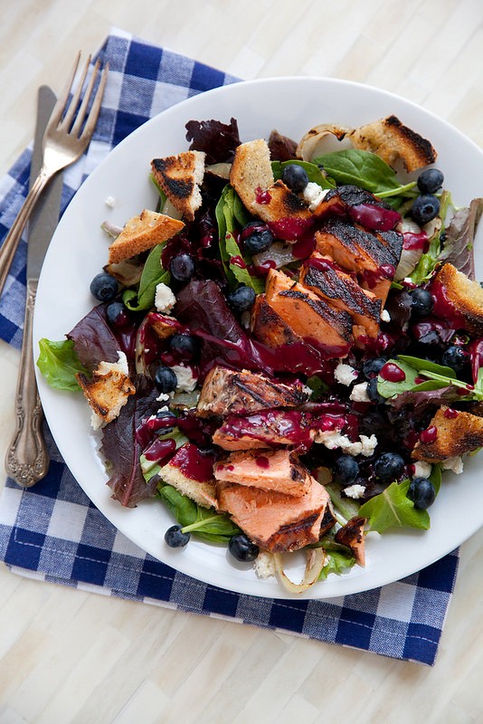 Grilled salmon salad with blueberry vinaigrette and goat cheese
