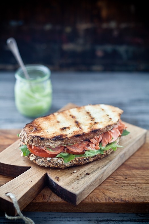 Grilled salmon sandwiches with pesto avocado spread