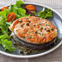 Grilled salmon steaks with lemon-caper sauce