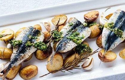 Grilled sardines with garlic roasted Jersey Royals and salsa verde
