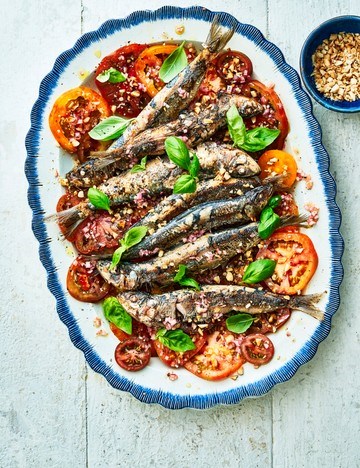 Grilled sardines with heirloom tomato and almond salad, and sherry vinegar dressing