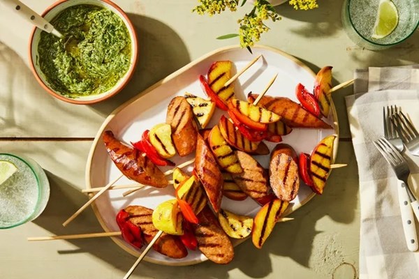 Grilled sausage and summer veggie skewers with creamy chimichurri