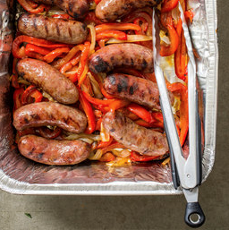 Grilled sausages with bell peppers and onions