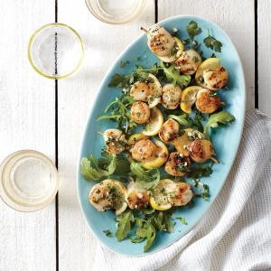 Grilled scallop scampi kebabs with arugula and herb salad
