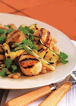 Grilled scallops, zucchini, and scallions with white beans