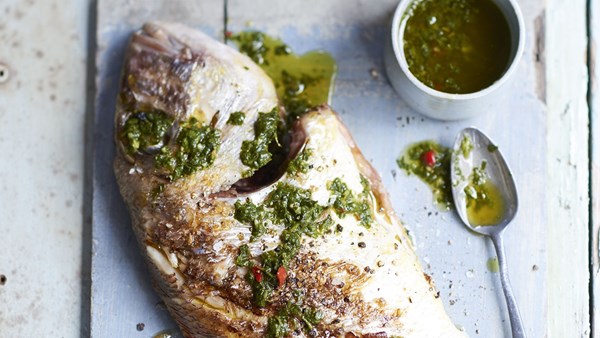 Grilled sea bream (sargo) with green herb sauce and fisherman’s potatoes