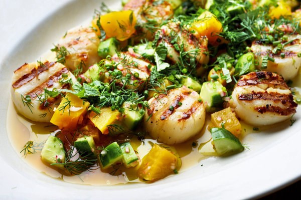 Grilled sea scallops with yellow beets, cucumbers and lime