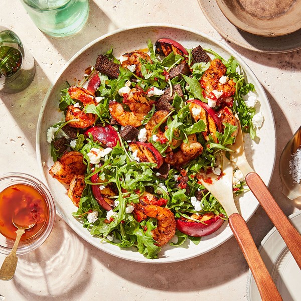 Grilled shrimp, peach & arugula salad with Calabrian chile vinaigrette