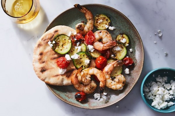 Grilled shrimp, zucchini, and tomatoes with feta