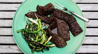 Grilled skirt steak with garlic and herbs