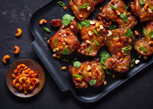 Grilled soy-basted chicken thighs with spicy cashews