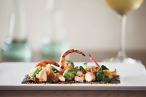 Grilled Spanish octopus salad with black garlic aïoli, guanciale, pea shoots, duck fat potatoes & pimentón