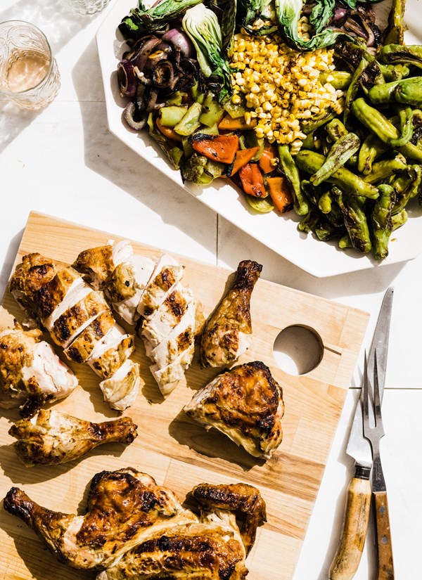 Grilled spatchcocked chicken in yogurt marinade with grilled pepper, bok choy and corn salad