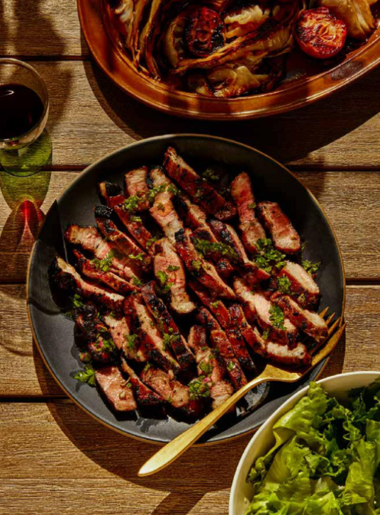 Grilled spiced pork shoulder steaks