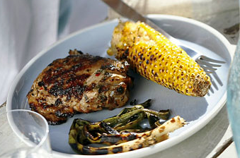 Grilled spicy-citrus chicken thighs with corn and green onions